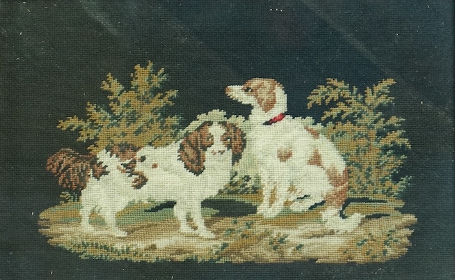A framed 19th century finely worked petite point embroidery of two Spaniels within a bushy landscape.19.5cm wide x 12.5 cm high. Condition- good